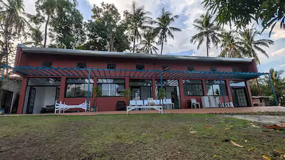 Building exterior within the Golden Sunset compound