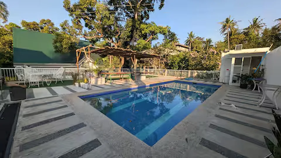 Swimming pool and landscaped deck within the Golden Sunset compound