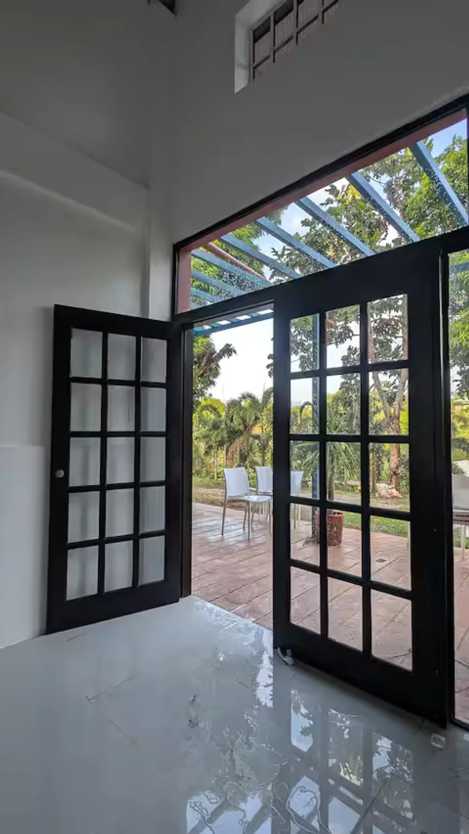 Garden view through the guest house glass doors