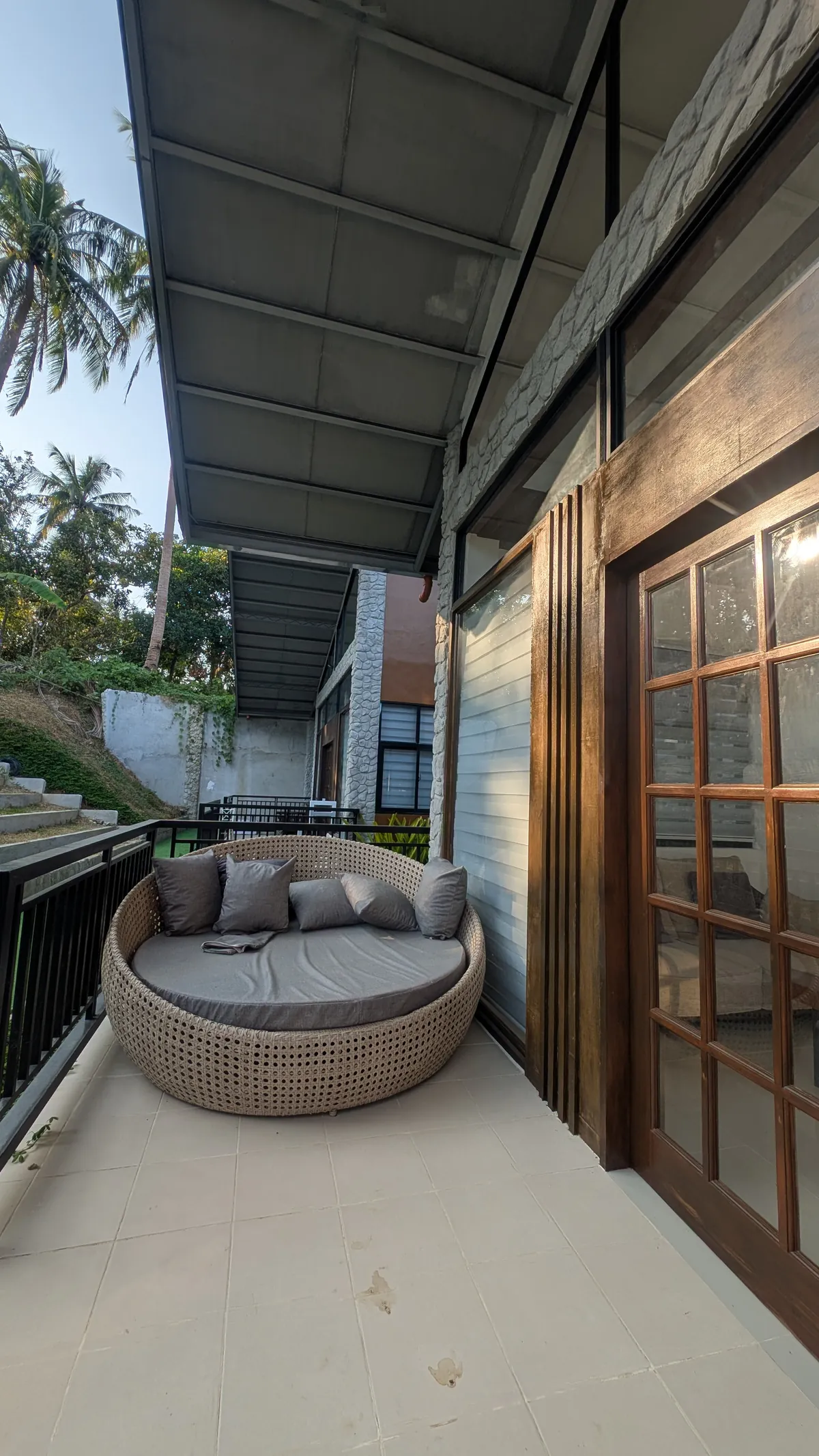 Covered patio seating outside a Golden Sunset unit