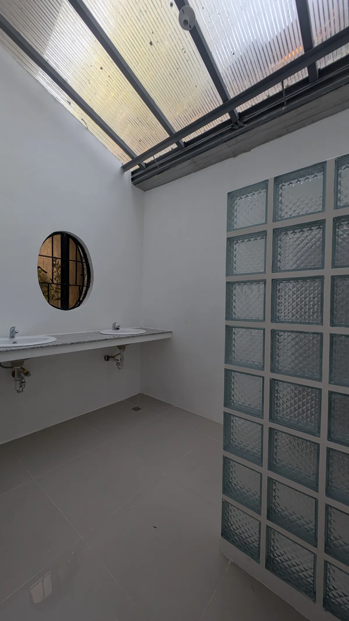 Bathroom vanity and glass-block shower partition