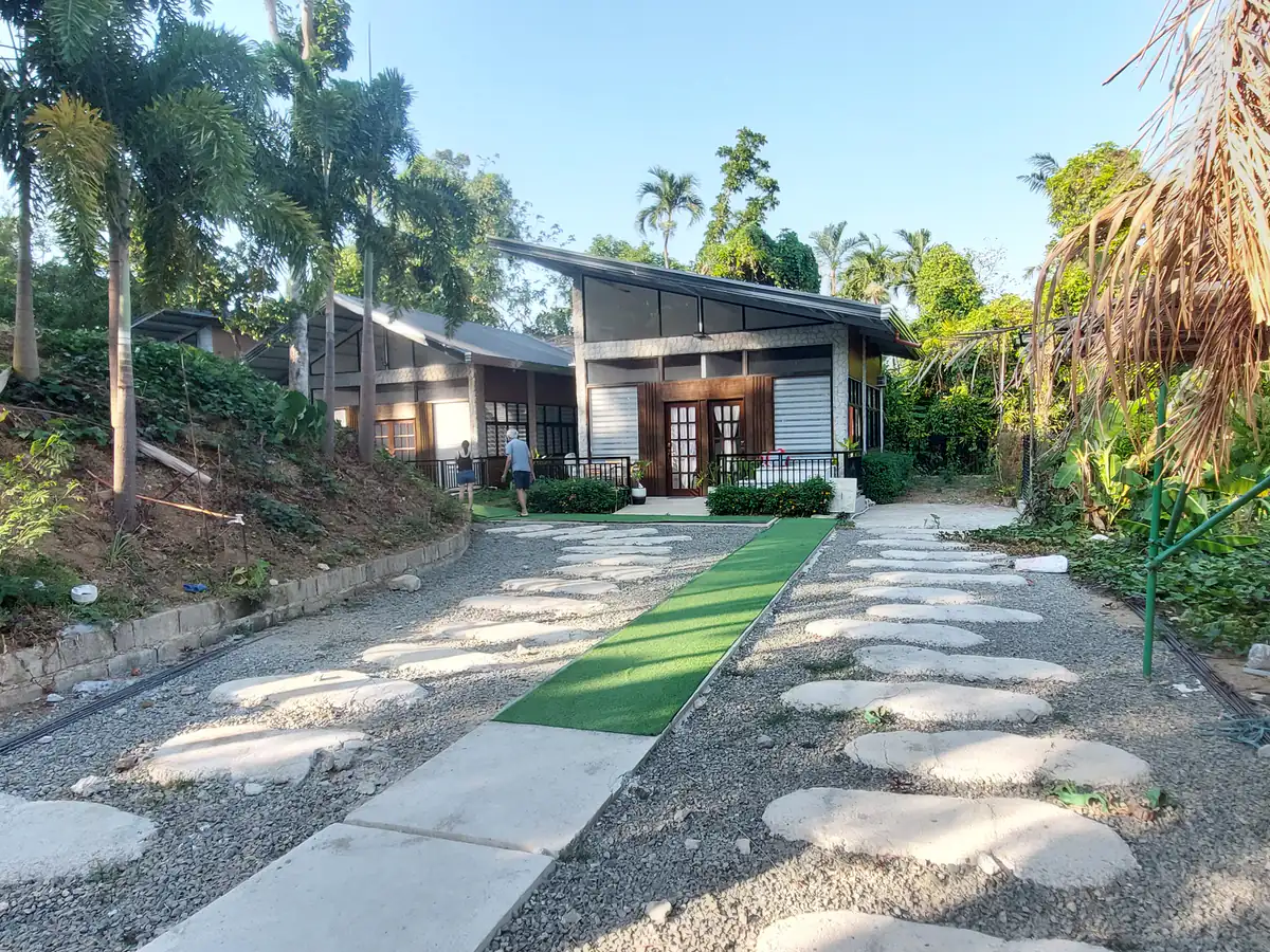 Wide stone walkway and gravel path through the Golden Sunset property