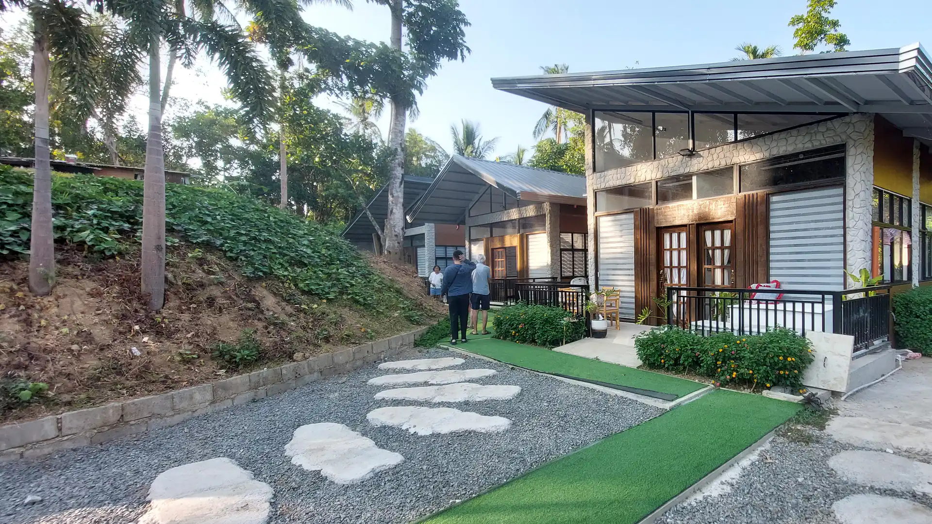 Stone walkway leading to Golden Sunset private lodging units