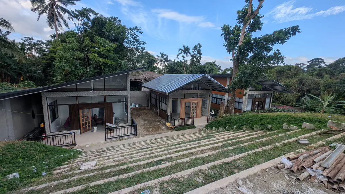 Elevated view of Golden Sunset lodging units surrounded by trees
